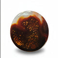 A round cabochon fire agate gemstone featuring a marbled pattern of deep brown, amber, and translucent white, displayed on a clean white background with a soft drop shadow.